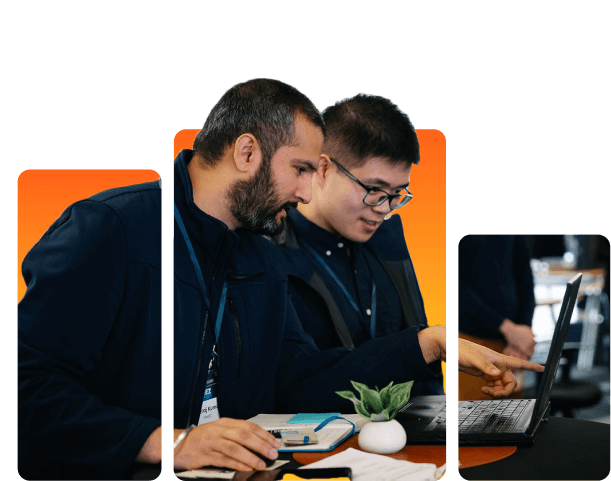 Two men collaborating on work at a computer